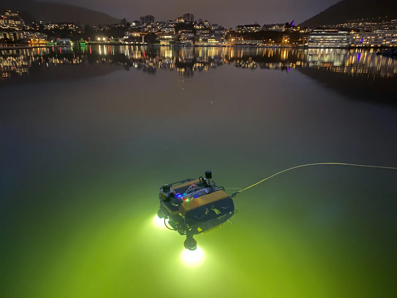 A Skarv vehicle lit up during a night survey in Bergen harbour