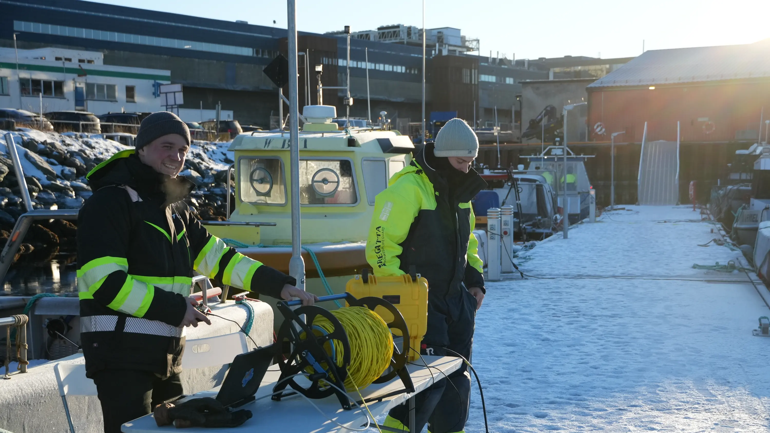Skarv engineers preparing a CORAX deployment from a quay in winter