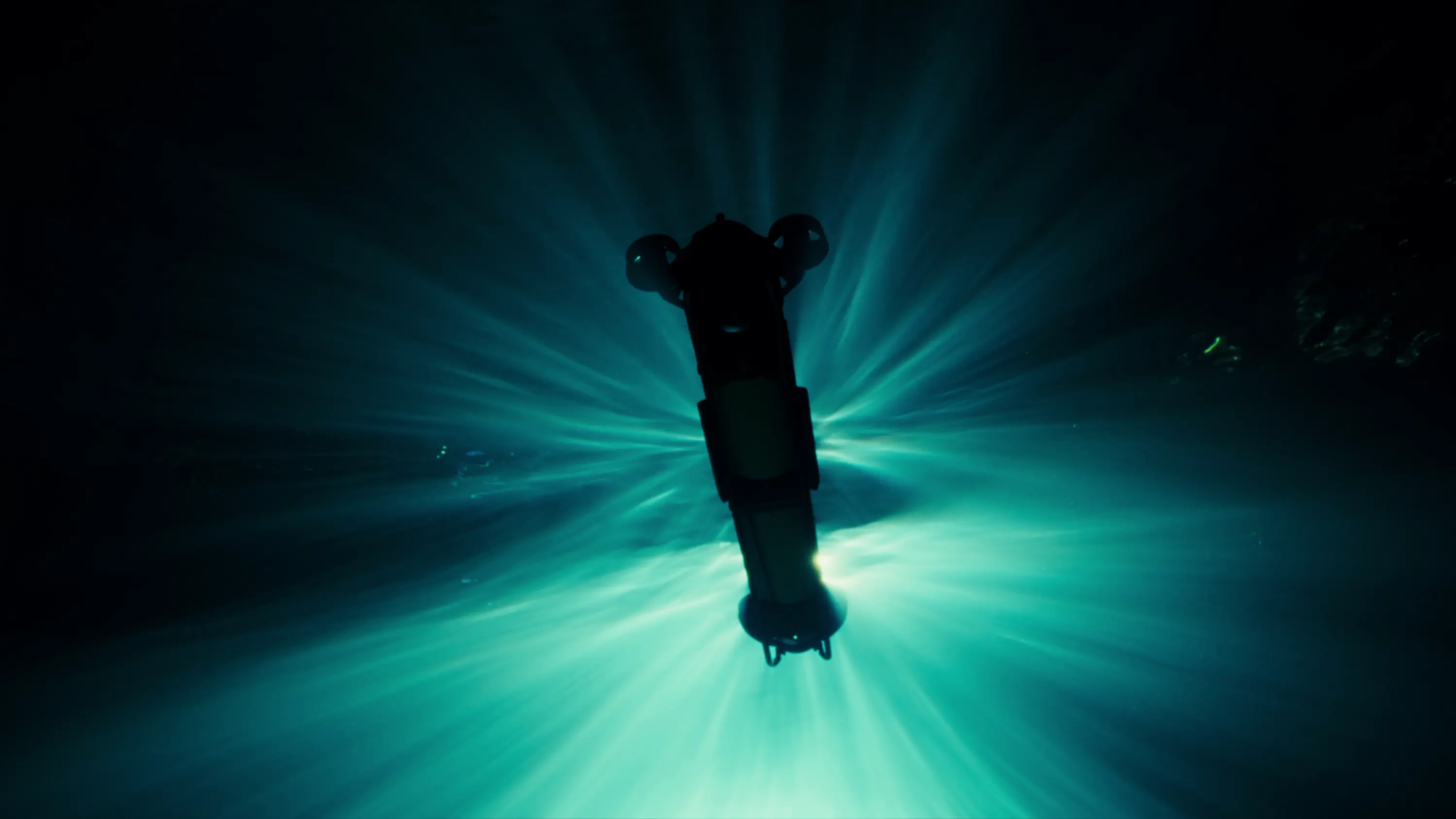 CORAX AUV under water with its lights on, seen head-on
