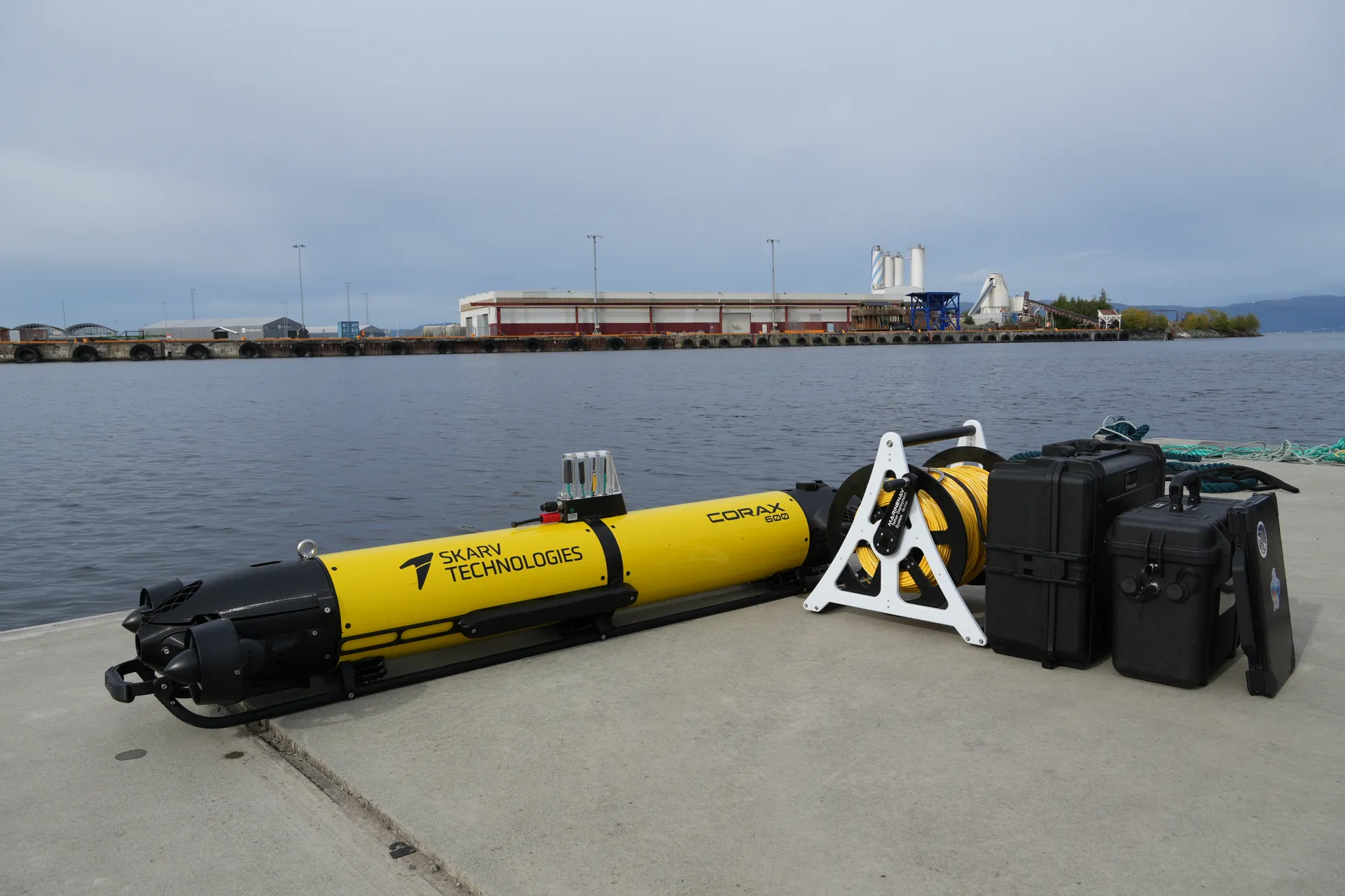 CORAX 600 with its tether reel and transport cases on the quay