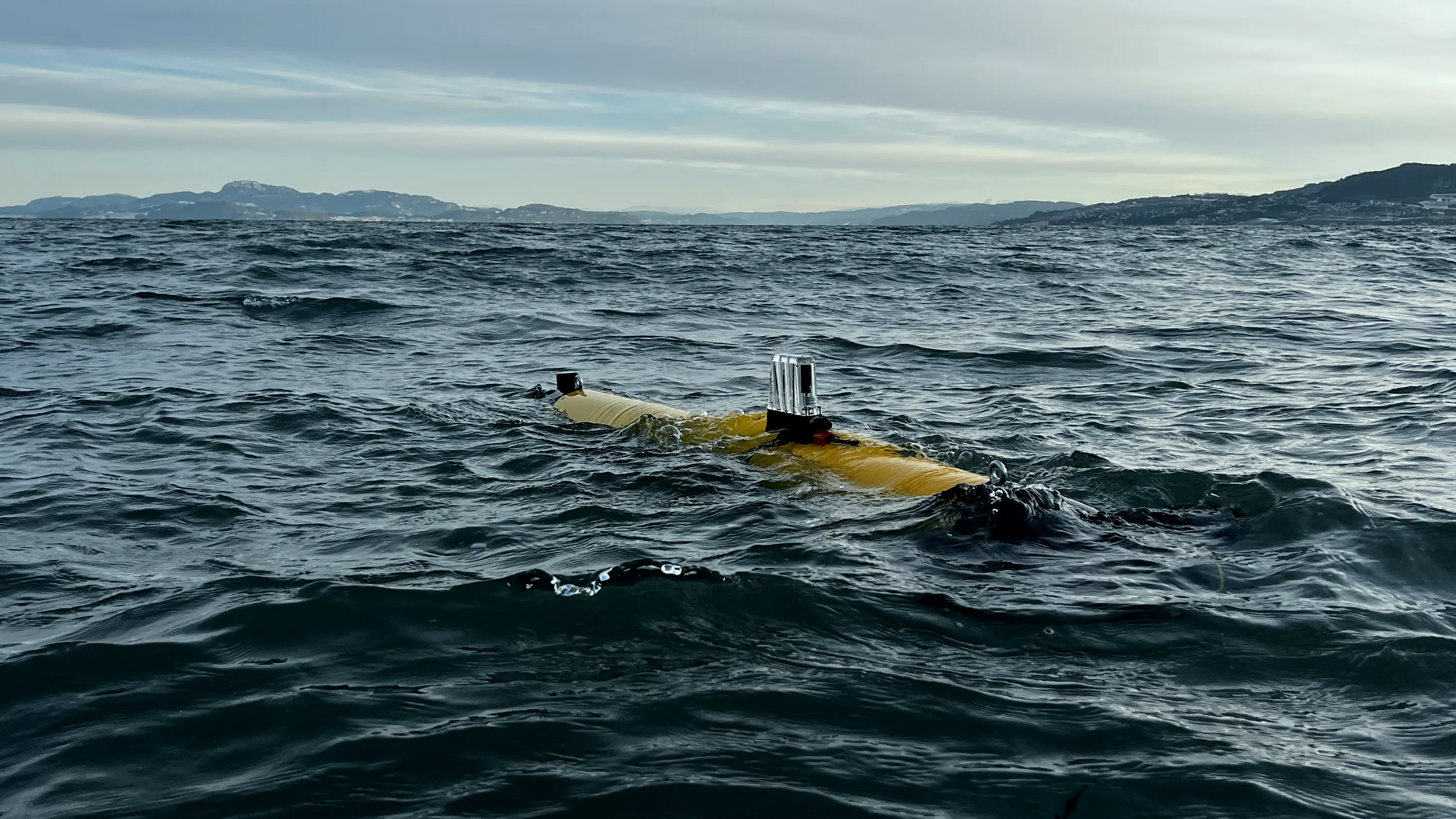 CORAX Endurance AUV operating at the surface in a Norwegian fjord